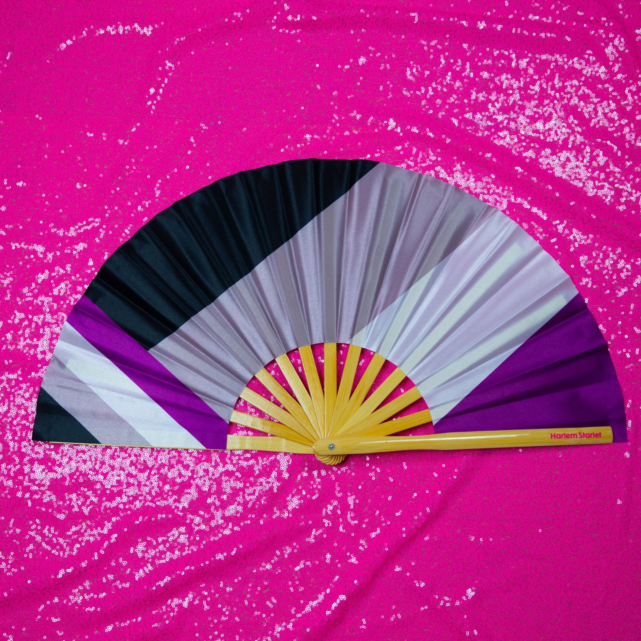 Bamboo clack fan featuring a vibrant Asexual flag design on a pink glitzy background, perfect for pride and festivals.